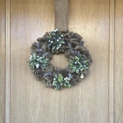 Wreath of mistletoe and pine cones